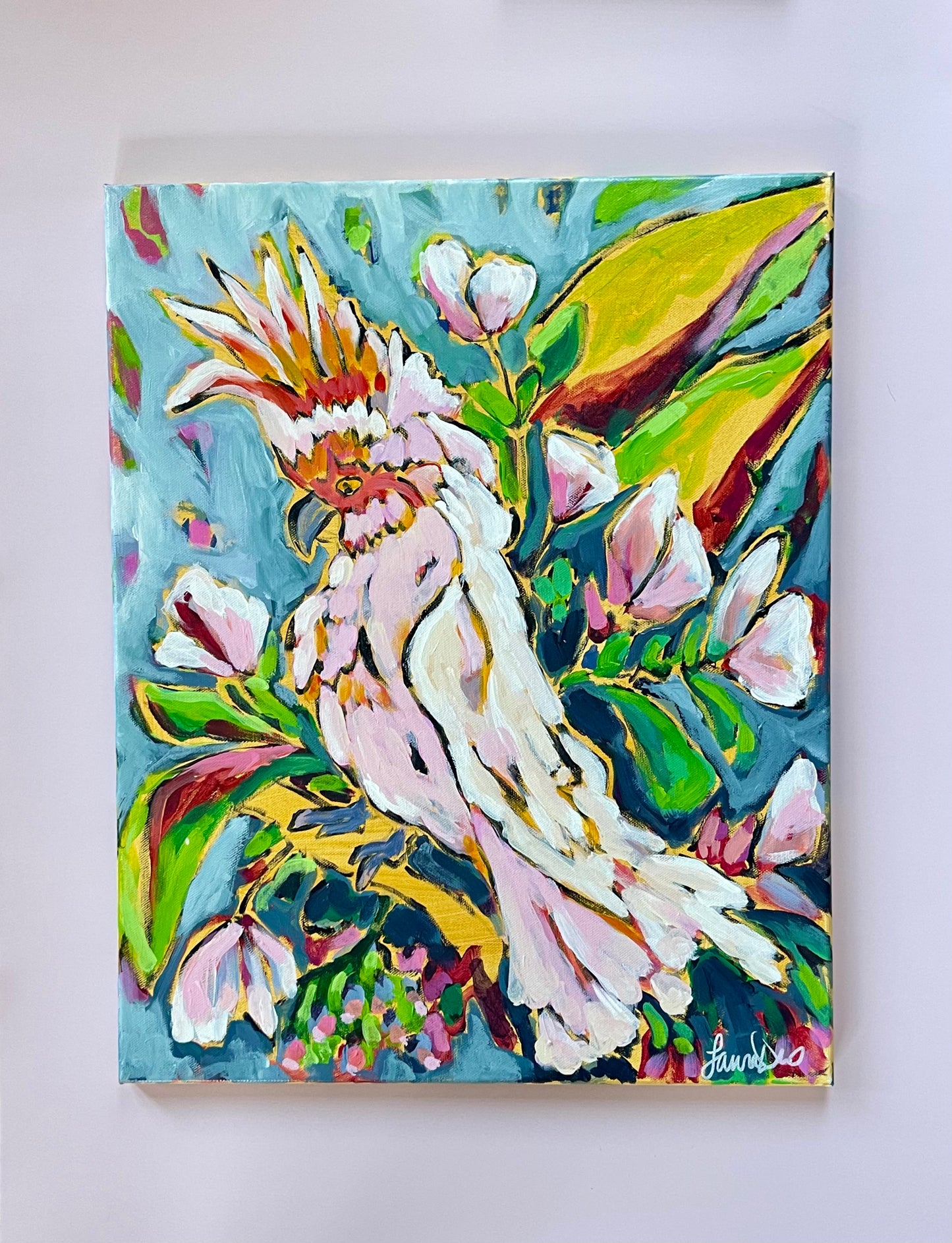 Colorful bird artwork in palm tree 